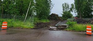 Crews performed clearing and grubbing work along the future Champlain Parkway alignment in preparation for construction. Clearing is the removal of vegetation above the ground such as trees and bushes and grubbing is the removal of subsurface vegetation such as stumps. Pictured near Sears Lane.