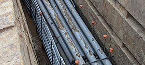 Aerial electrical and telecommunication utilities were relocated underground throughout portions of the south end. Crews installing underground electrical and telecommunication duct bank. This segment crosses the Champlain Parkway and Briggs Street.