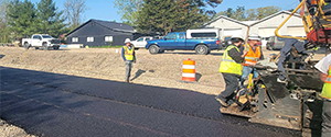 Crews base paving Batchelder Street.