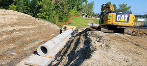 The Champlain Parkway included several stormwater features including the construction of a stormwater detention pond near Englesby Brook. Pictured outlet pipe on footing and headwall form.