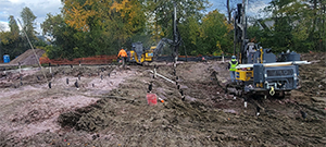 Crews prepare the site for blasting to remove ledge along the east side of Briggs Street just south of Flynn Avenue.