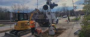 Installation of the new signal and gate at the railroad crossing at Flynn Avenue.