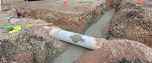 Installation of concrete-encased electrical sleeves and drainage on Batchelder Street.
