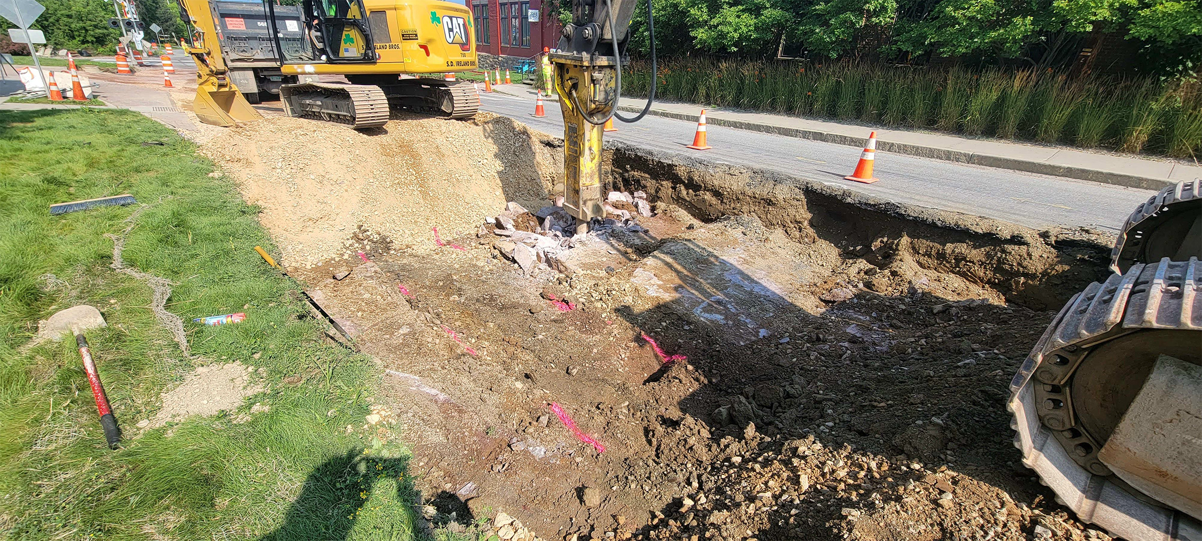 Removal of ledge on Flynn Avenue using a hammer as part of the full-depth roadway reconstruction.