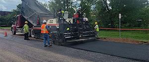 Base course paving along Flynn Avenue west of the Flynn Avenue railroad crossing.