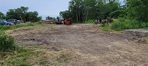 Crews performed clearing and grubbing work along the future Champlain Parkway alignment in preparation for construction. Clearing is the removal of vegetation above the ground such as trees and bushes and grubbing is the removal of subsurface vegetation such as stumps.