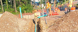 Installation of six-inch conduit sleeve underneath the Parkway just south of Home Avenue. This conduit sleeve will later be encased in concrete.