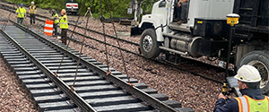 Installation of pre-assembled continuous welded rail and ties for the Flynn Avenue siding.