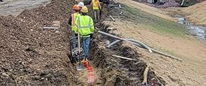 Installation of lighting conduit and light pole foundations near the Englesby grass swale.