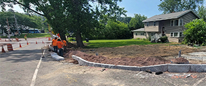 Installation of granite curb at the intersection of Home Avenue at the Parkway (northwest corner).