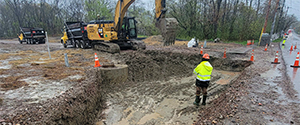 Crews excavating the section of the Parkway just north of the Flynn Avenue intersection.