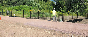 Installation of decorative fencing along the shared use path and the pocket park along the northeast corner of the intersection of Flynn Avenue and the Parkway.