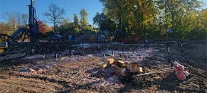 Crews prepare the site for blasting to remove ledge along the east side of Briggs Street just south of Flynn Avenue.