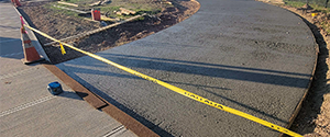 Placing the concrete support for the brick pavers at the pocket park on the northeast corner of the intersection of Flynn Avenue at the Parkway.