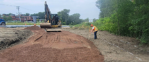 Installation of crushed stone subbase in preparation for the concrete slab support for the brick pavers at the Flynn Avenue pocket park.