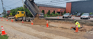 The installation of dense grade subbase material on Flynn Avenue.