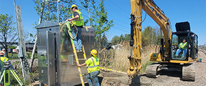 Installation of the signal house for the Flynn Avenue railroad crossing.