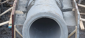 The Champlain Parkway included several stormwater features including the construction of a stormwater detention pond near Englesby Brook. Pictured outpipe, headwall, and concrete pours.